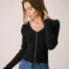 The Black V Neck Pearl Button Knit Top